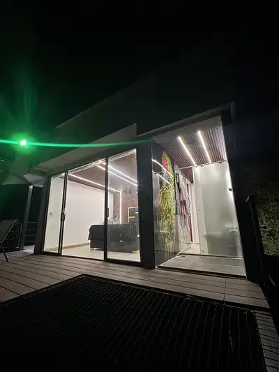 The glass front of the cabin opening onto the deck.